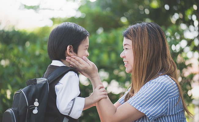 Mom giving advice to child before school