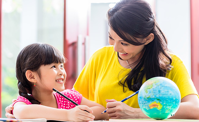 Homeschooling: Mom teaching child to colour