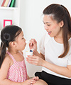 Mom feeding child