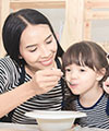 Mom feeding child