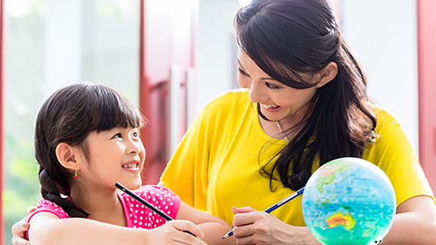 Mom teaching child to color